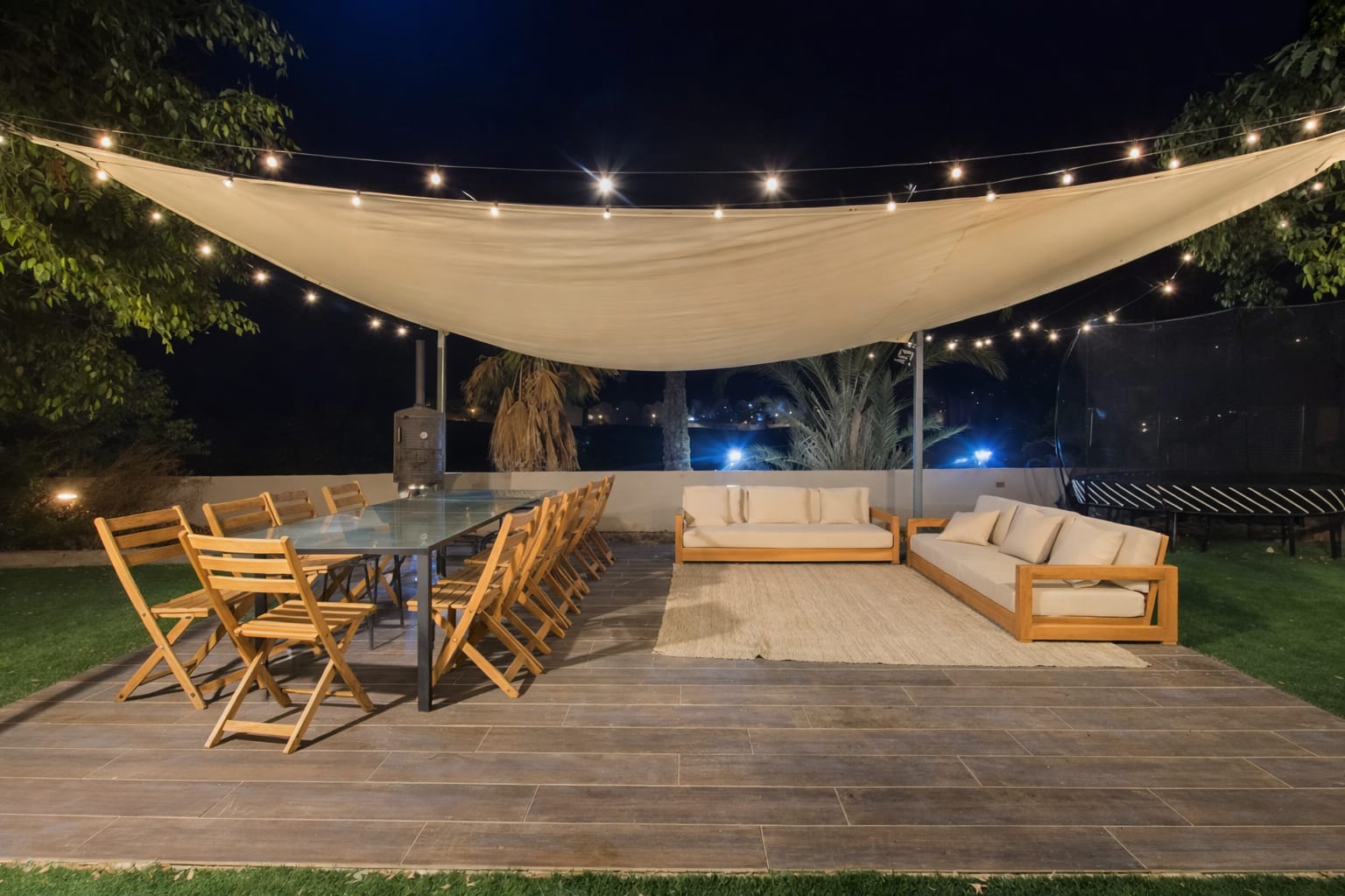 Outdoor dining area under string lights